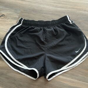 Grey Nike shorts with white lining.